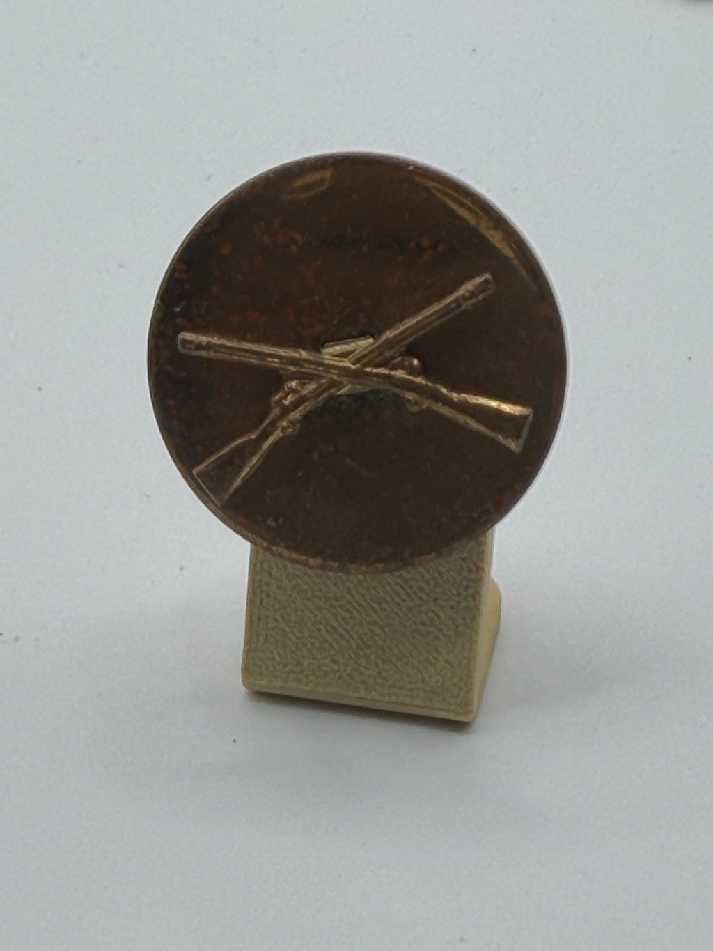 U.S. Army Infantry Collar Disk – Crossed Rifles (WWII–Post‑War Era, Bronze with Dark Patina)